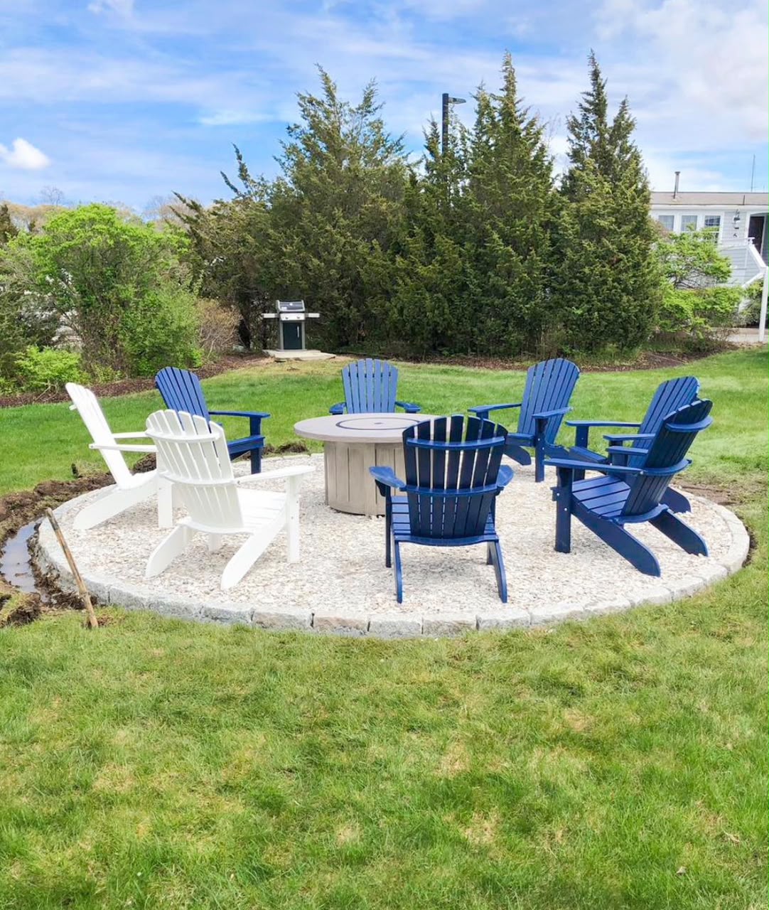 Finished backyard fire pit seating area in Cape Cod