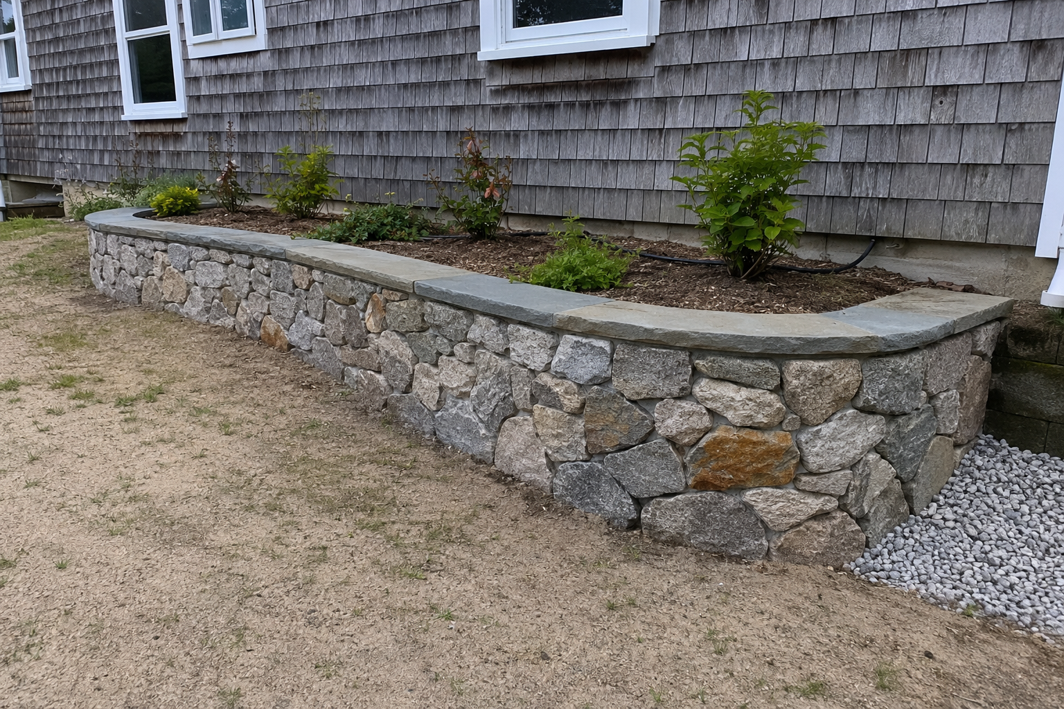 Natural fieldstone wall construction in Cape Cod, MA