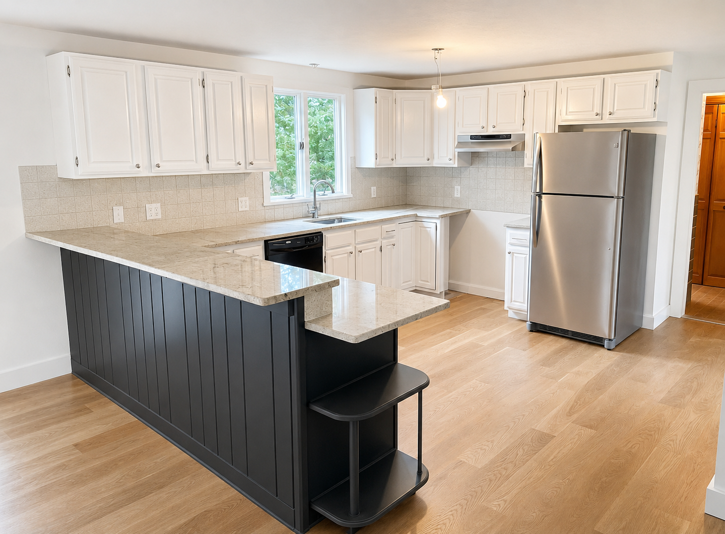 Completed white kitchen remodeling project with island and stone countertops in Cape Cod