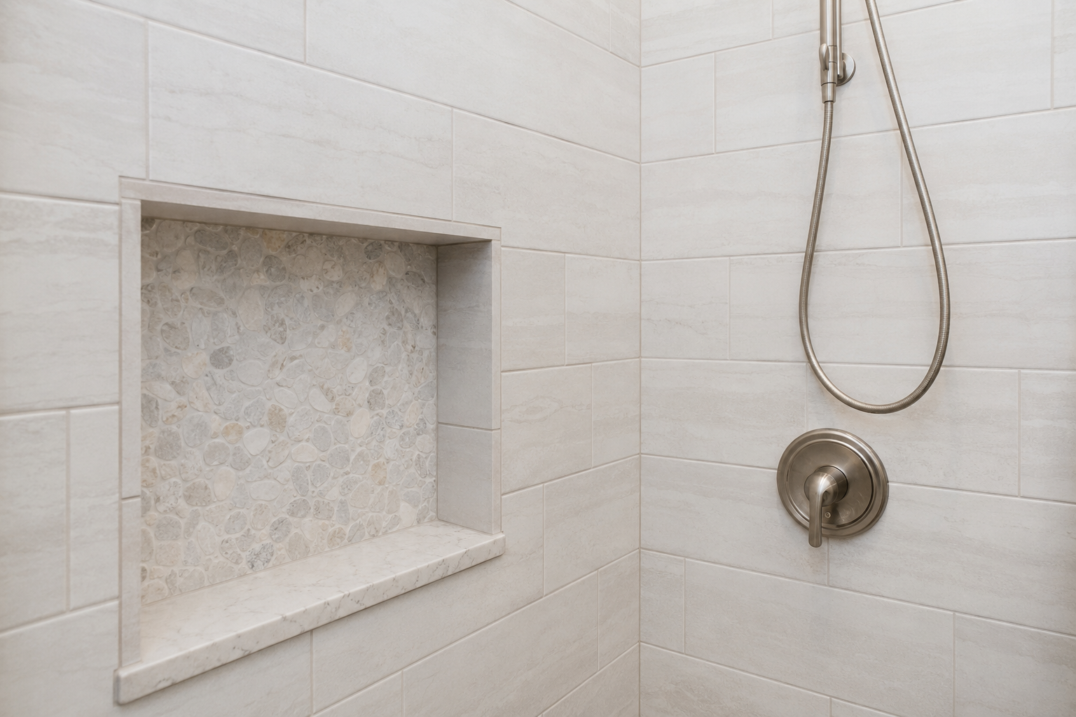Completed shower tile installation with waterproof walls in a Cape Cod bathroom