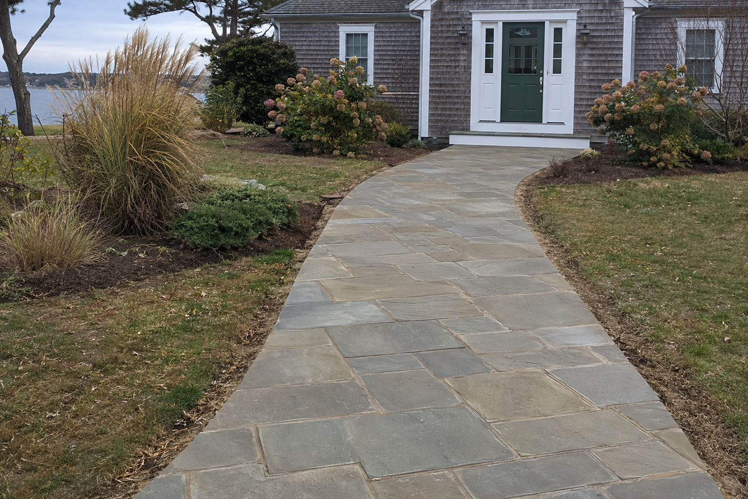 Brick walkway installation leading to a Cape Cod home in Massachusetts