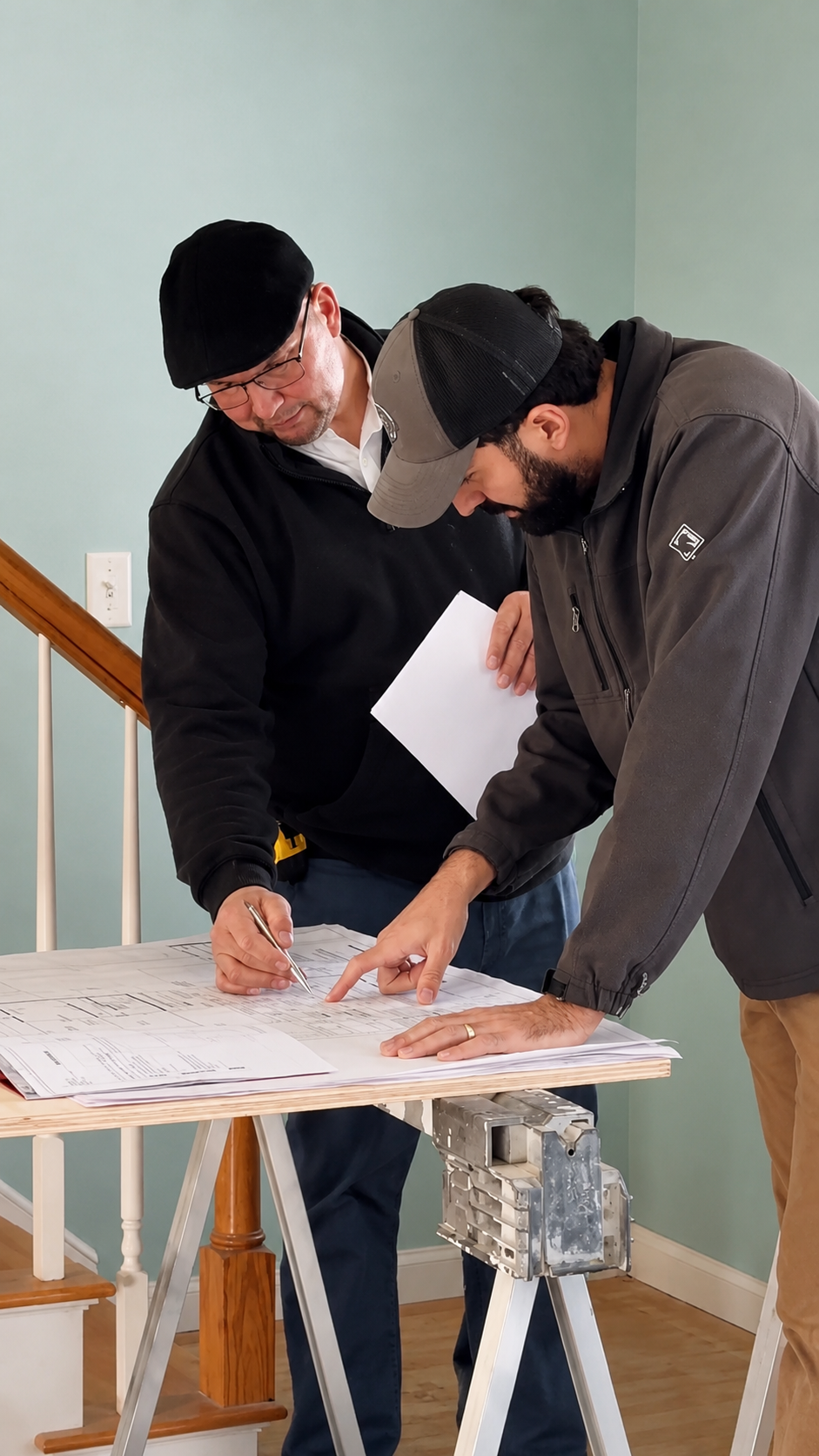 General contractor reviewing construction plans in Barnstable, MA